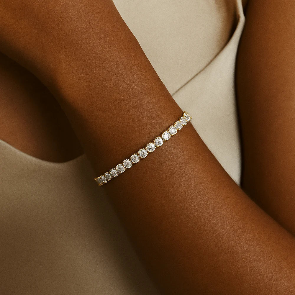 Gullbelagt tennisarmbånd med moissanitt