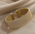 Elegant flettet mesh-armbånd med åpent design