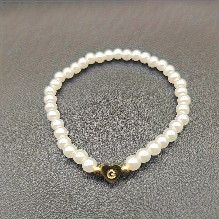 Elegant armbånd med hjerte-initial (A-Å)