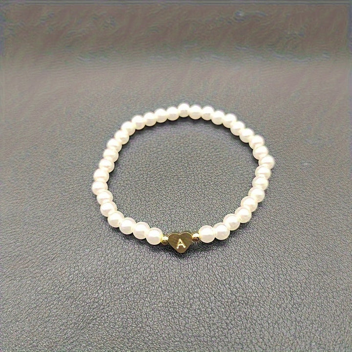 Elegant armbånd med hjerte-initial (A-Å)